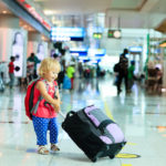 little girl with suitcase travel in the airport, kids travel